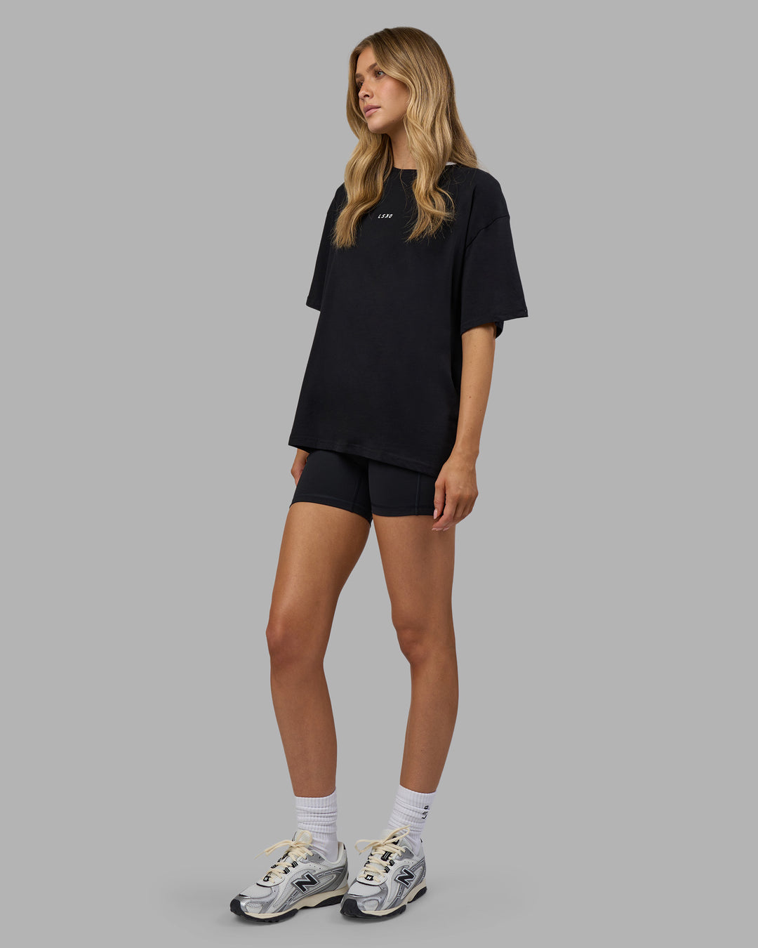 Woman wearing Go-To FLXCotton Oversized Tee - Black-White | Model:Leilani | Size:XS