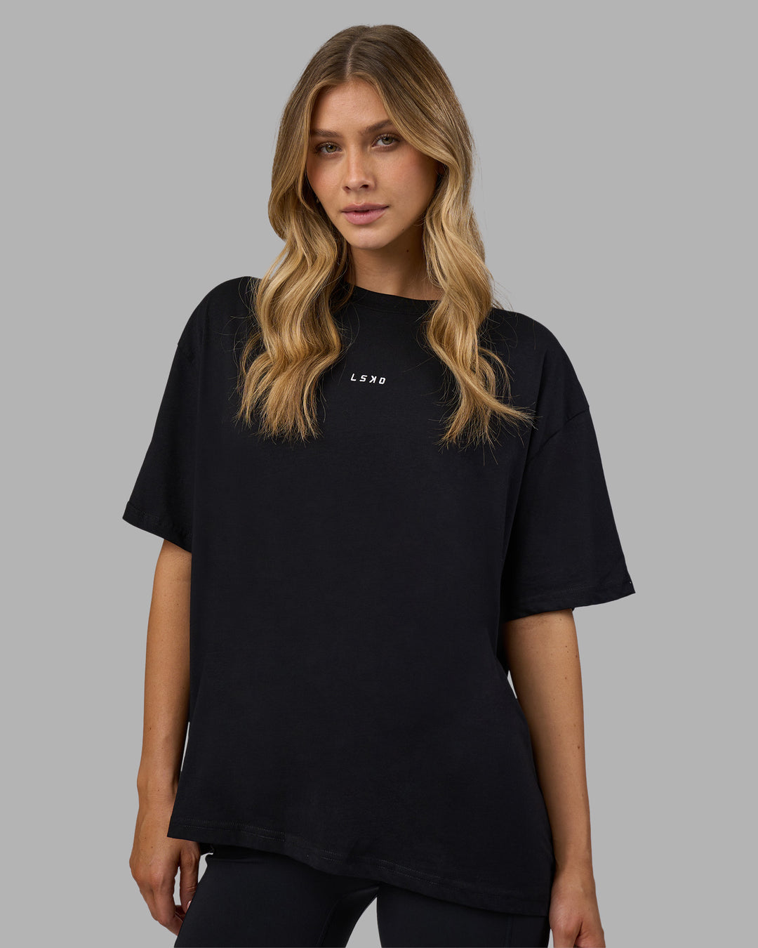 Woman wearing Go-To FLXCotton Oversized Tee - Black-White | Model:Leilani | Size:XS