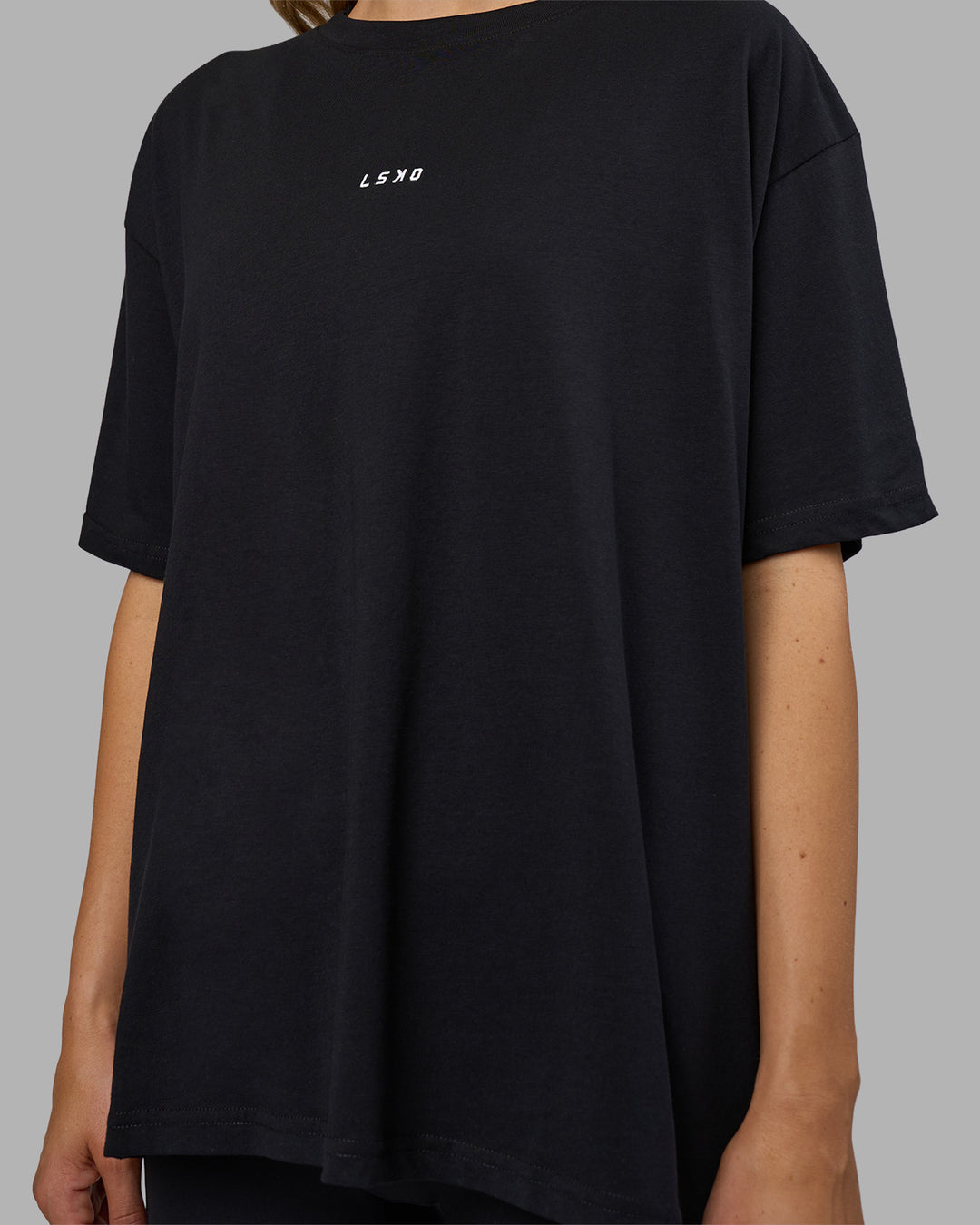 Woman wearing Go-To FLXCotton Oversized Tee - Black-White | Model:Leilani | Size:XS