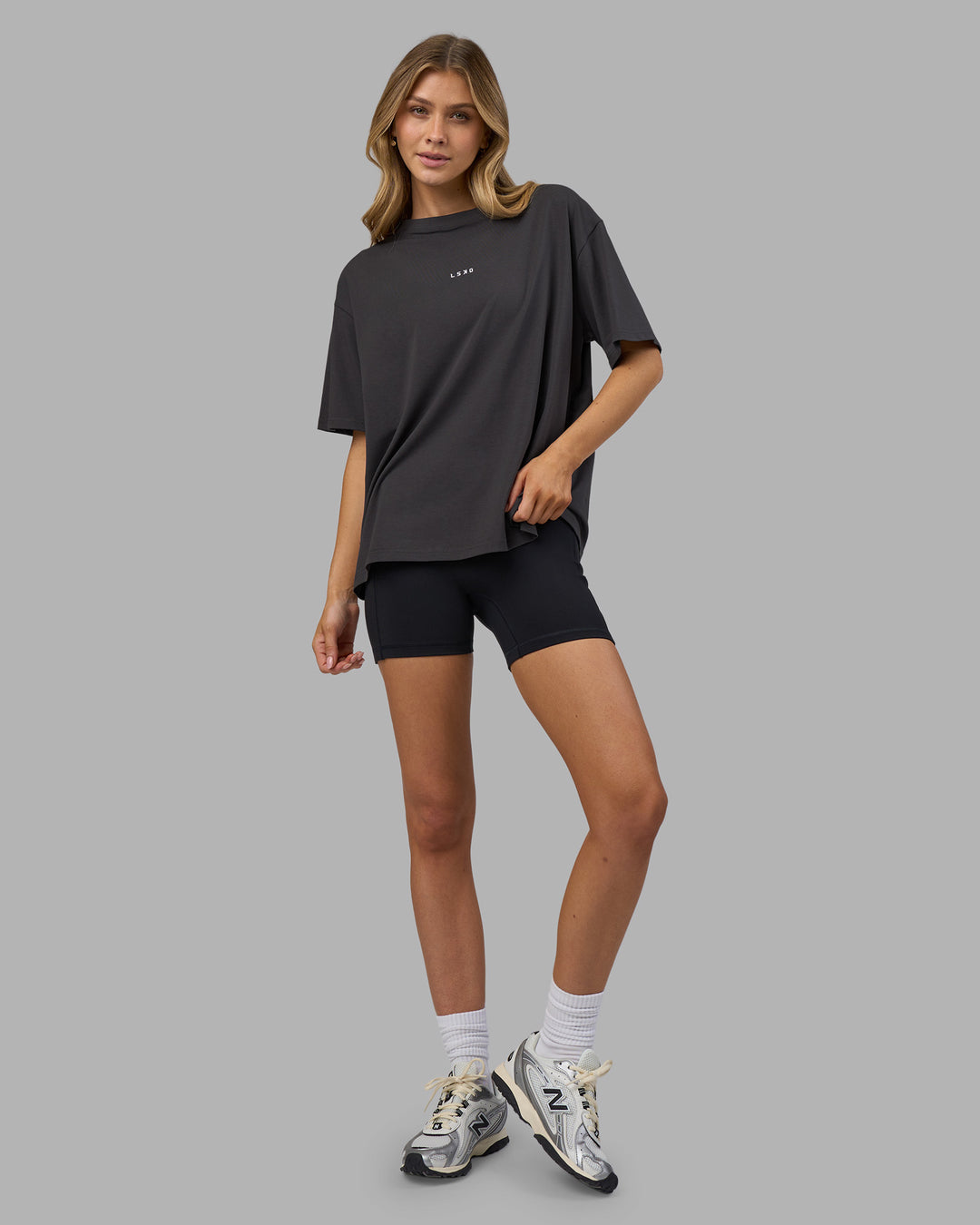 Woman wearing Go-To FLXCotton Oversized Tee - Dark Storm-White | Model:Leilani | Size:XS