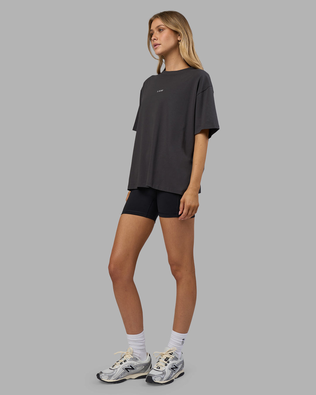 Woman wearing Go-To FLXCotton Oversized Tee - Dark Storm-White | Model:Leilani | Size:XS