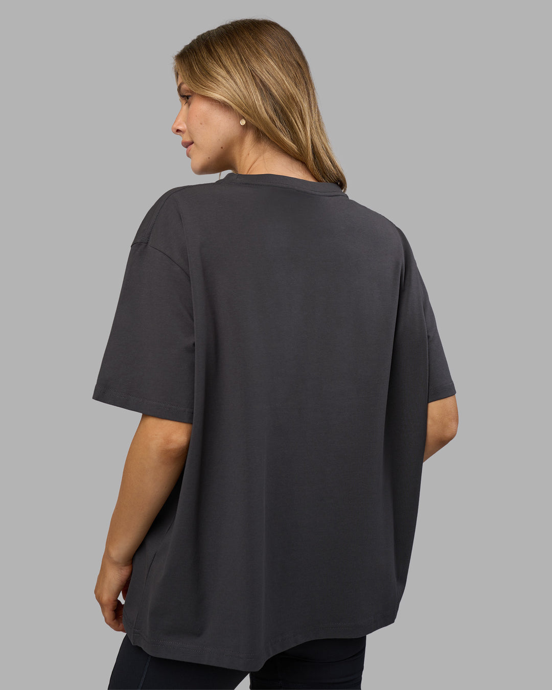 Woman wearing Go-To FLXCotton Oversized Tee - Dark Storm-White | Model:Leilani | Size:XS