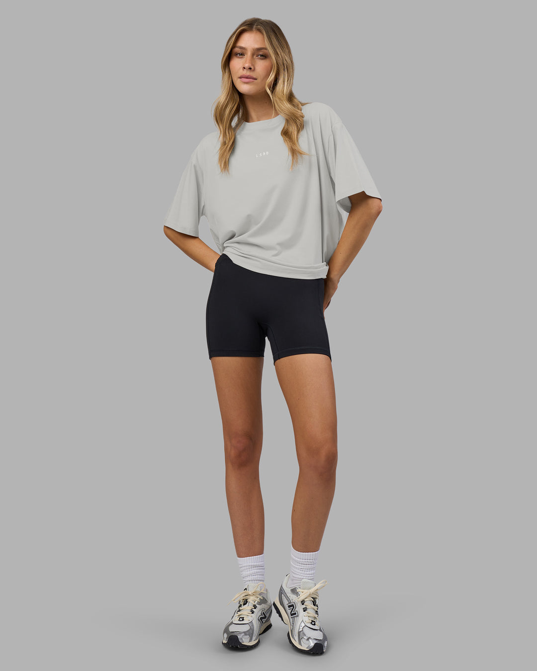 Woman wearing Go-To FLXCotton Oversized Tee - Digital Mist-White | Model:Leilani | Size:XS