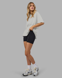 Woman wearing Go-To FLXCotton Oversized Tee - Digital Mist-White | Model:Leilani | Size:XS