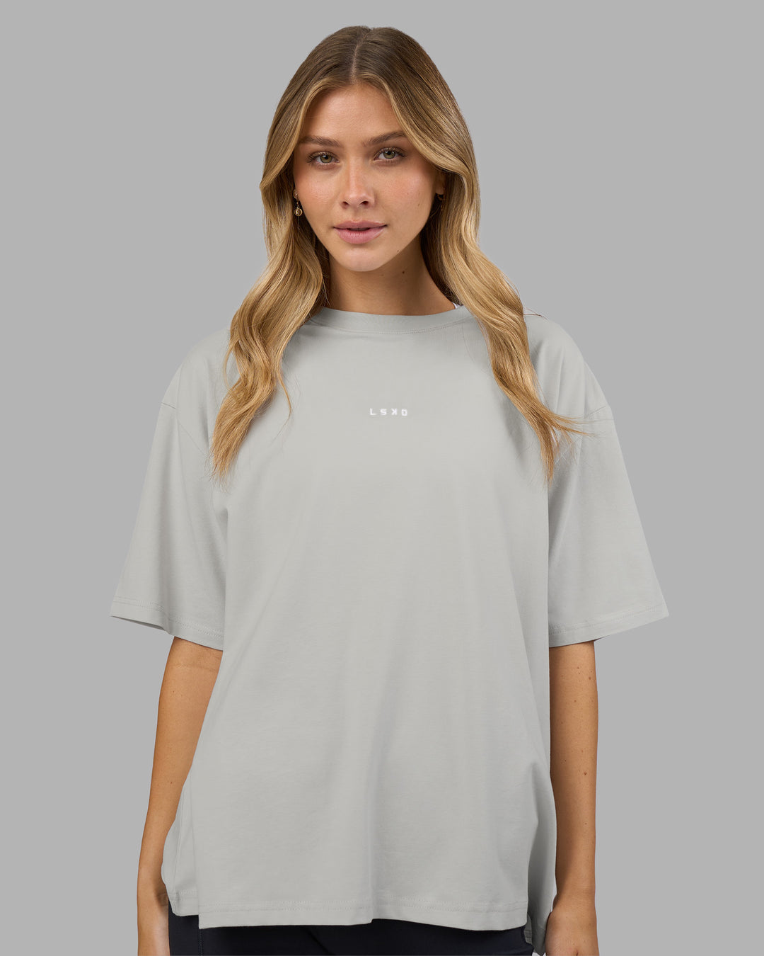 Woman wearing Go-To FLXCotton Oversized Tee - Digital Mist-White | Model:Leilani | Size:XS