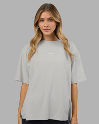 Woman wearing Go-To FLXCotton Oversized Tee - Digital Mist-White | Model:Leilani | Size:XS