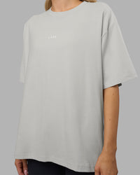 Woman wearing Go-To FLXCotton Oversized Tee - Digital Mist-White | Model:Leilani | Size:XS