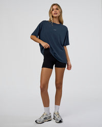 Woman wearing Go-To FLXCotton Oversized Tee - Future Navy Washed | Model:Leilani | Size:XS