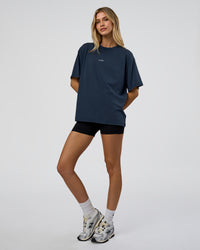 Woman wearing Go-To FLXCotton Oversized Tee - Future Navy Washed | Model:Leilani | Size:XS