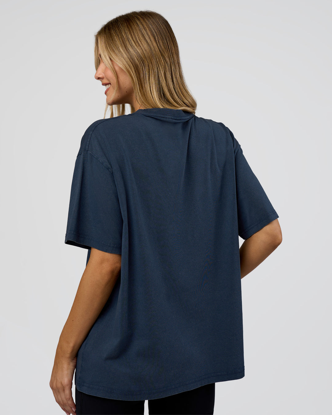 Woman wearing Go-To FLXCotton Oversized Tee - Future Navy Washed | Model:Leilani | Size:XS