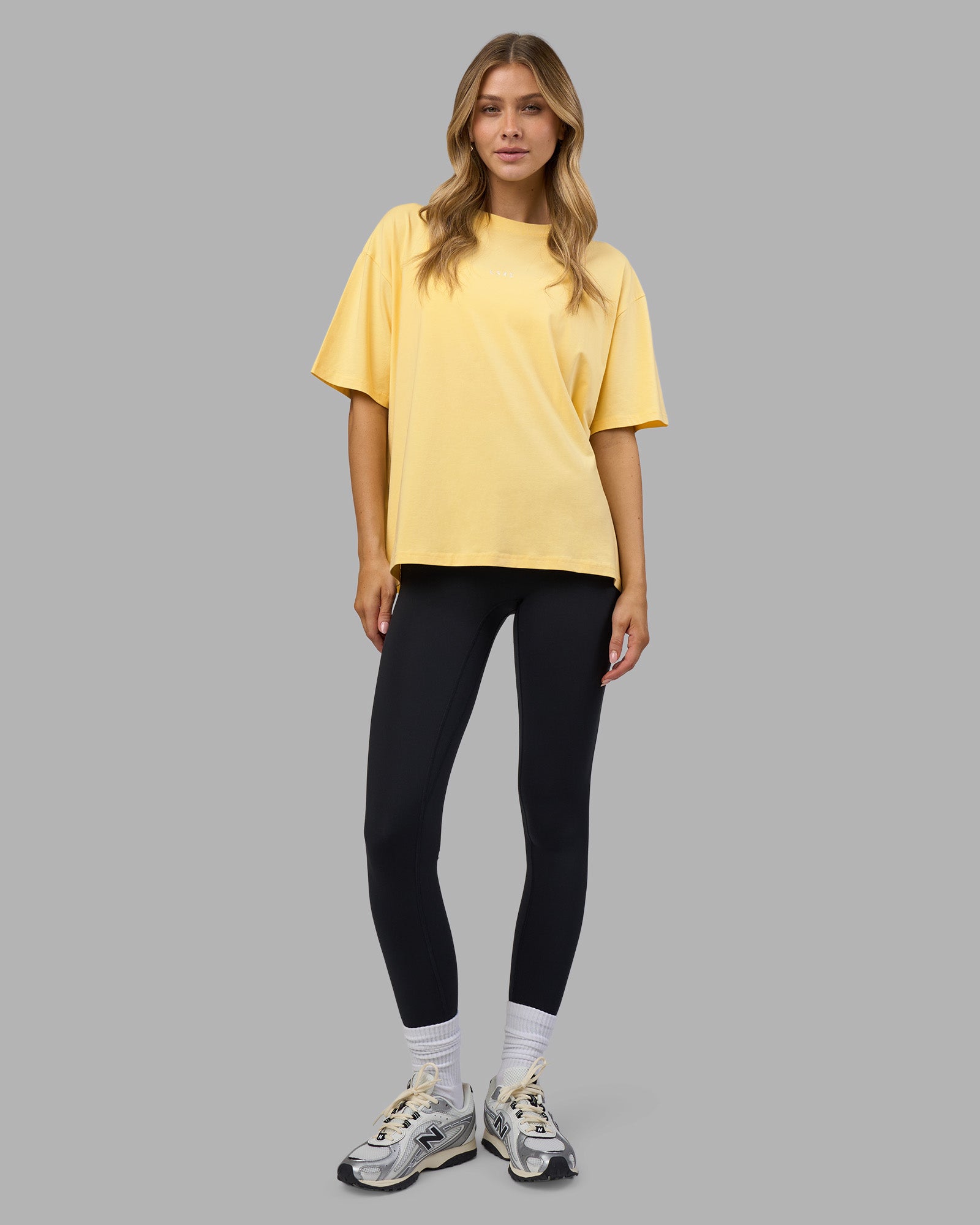 Woman wearing Go-To FLXCotton Oversized Tee - Lemon-White | Model:Leilani | Size:XS