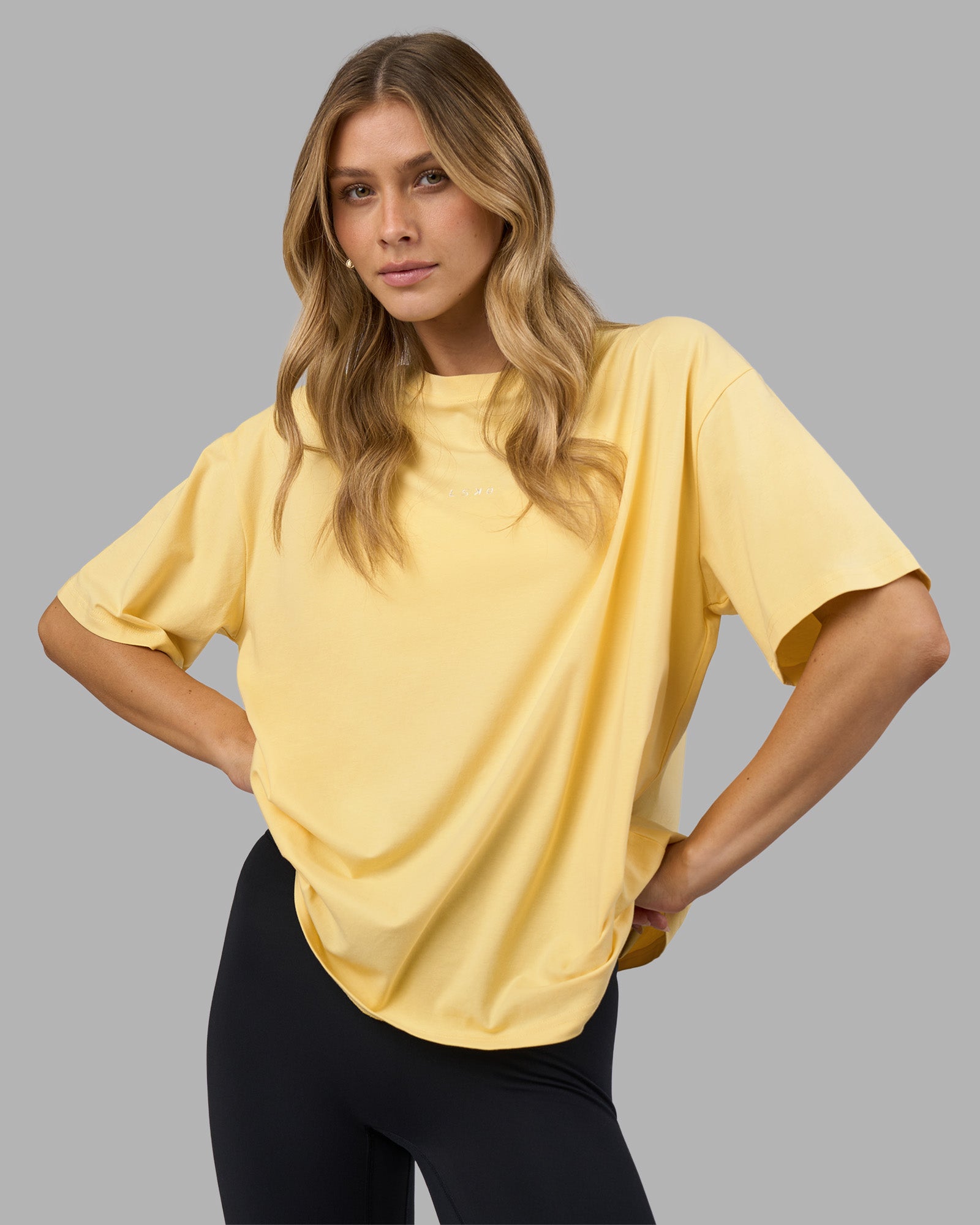 Woman wearing Go-To FLXCotton Oversized Tee - Lemon-White | Model:Leilani | Size:XS