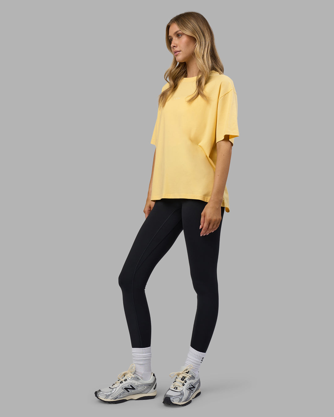 Woman wearing Go-To FLXCotton Oversized Tee - Lemon-White | Model:Leilani | Size:XS