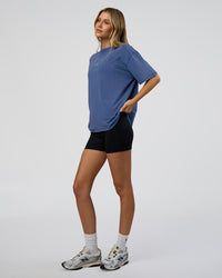 Woman wearing Go-To FLXCotton Oversized Tee - Midnight Blue Washed-White | Model:Leilani | Size:XS