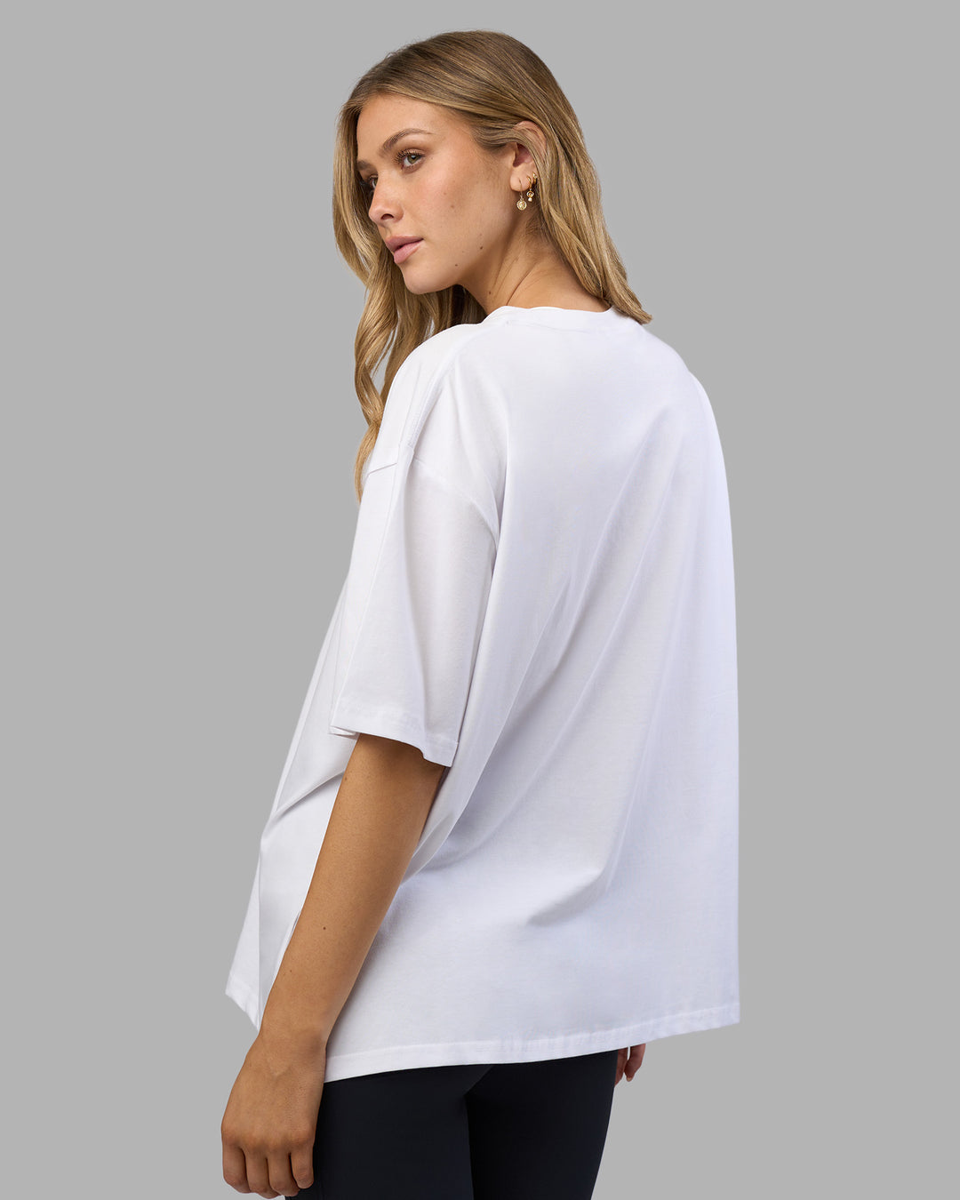Woman wearing Go-To FLXCotton Oversized Tee - White-Black | Model:Leilani | Size:XS