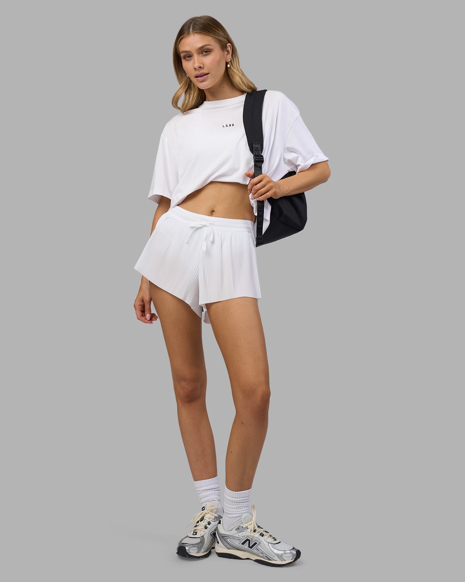 Woman wearing Go-To FLXCotton Oversized Tee - White-Black | Model:Leilani | Size:XS