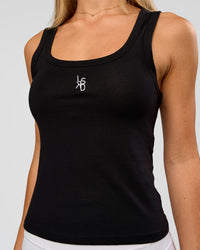 Woman wearing Go-To FLXCotton Scoop Neck Tank in Black-White | Model:Issy | Size:XS | Thumbnail Index: 0