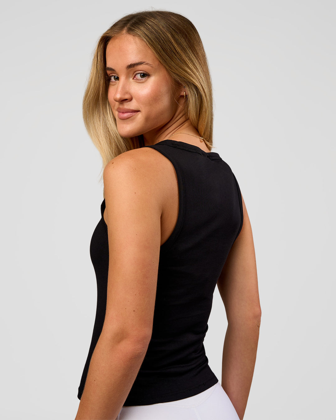 Woman wearing Go-To FLXCotton Scoop Neck Tank in Black-White | Model:Issy | Size:XS - view 3