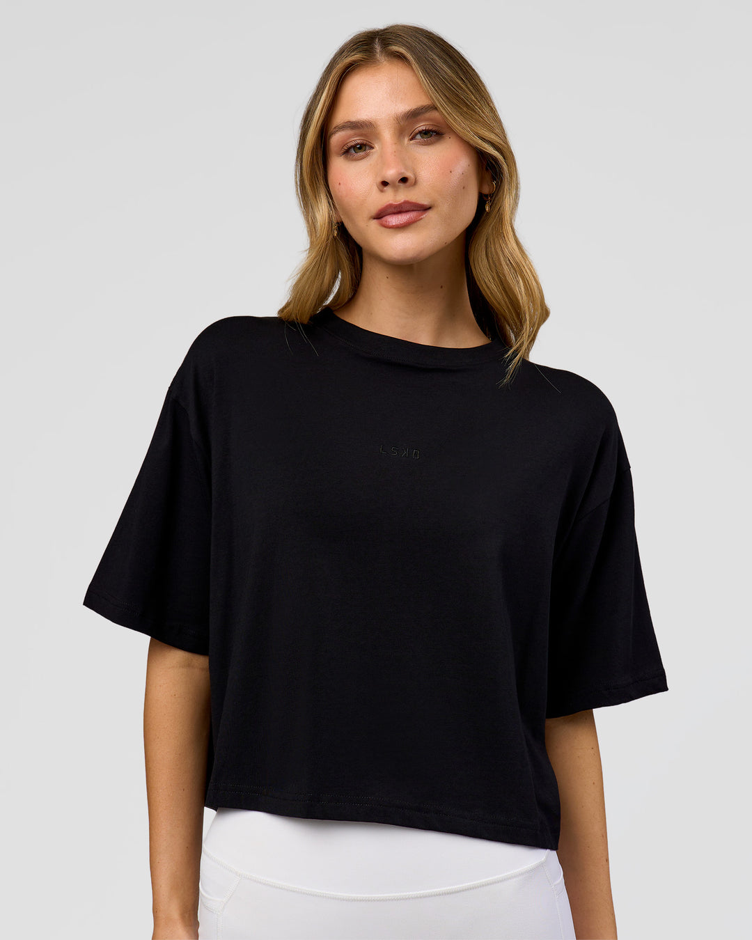 Woman wearing Go-To FLXCotton Skimmer Tee - Black-Black | Model:Leilani | Size:XS
