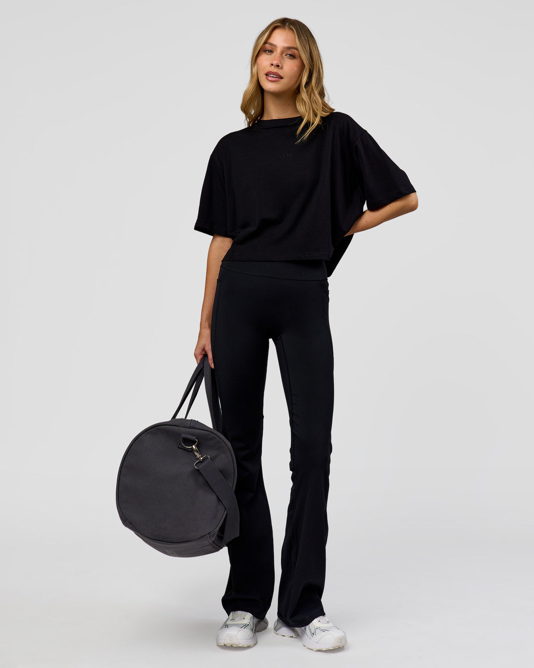 Woman wearing Go-To FLXCotton Skimmer Tee - Black-Black | Model:Leilani | Size:XS