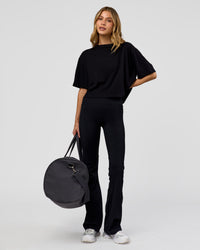 Woman wearing Go-To FLXCotton Skimmer Tee - Black-Black | Model:Leilani | Size:XS