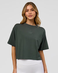 Woman wearing Go-To FLXCotton Skimmer Tee - Carbon Green-Carbon Green | Model:Leilani | Size:XS