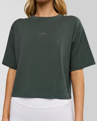 Woman wearing Go-To FLXCotton Skimmer Tee - Carbon Green-Carbon Green | Model:Leilani | Size:XS