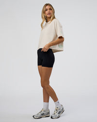 Woman wearing Go-To Heavy Weight FLXCotton Graphic Skimmer Tee - Off White-Multi | Model:Leilani | Size:XS