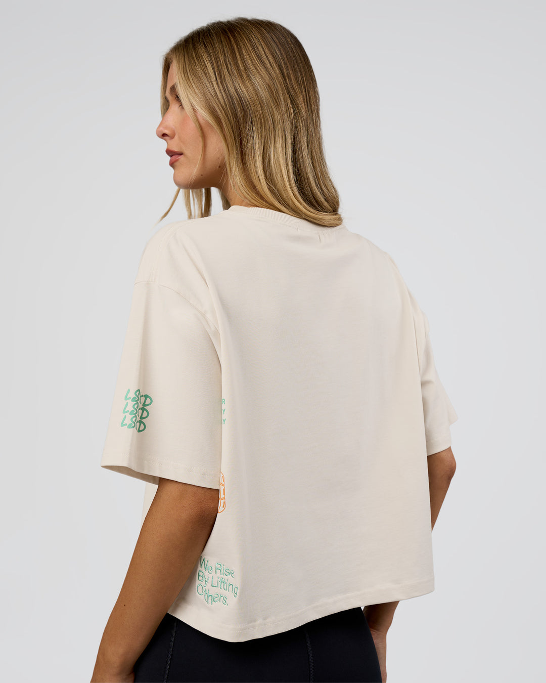 Woman wearing Go-To Heavy Weight FLXCotton Graphic Skimmer Tee - Off White-Multi | Model:Leilani | Size:XS