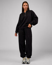 Woman wearing Go-To Oversized Quarter Zip Sweater - Black | Model:Brylee | Size:XS
