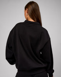 Woman wearing Go-To Oversized Quarter Zip Sweater - Black | Model:Brylee | Size:XS