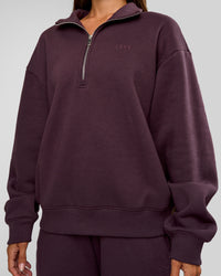 Woman wearing Go-To Oversized Quarter Zip Sweater - Midnight Plum | Model:Brylee | Size:XS