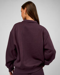 Woman wearing Go-To Oversized Quarter Zip Sweater - Midnight Plum | Model:Brylee | Size:XS