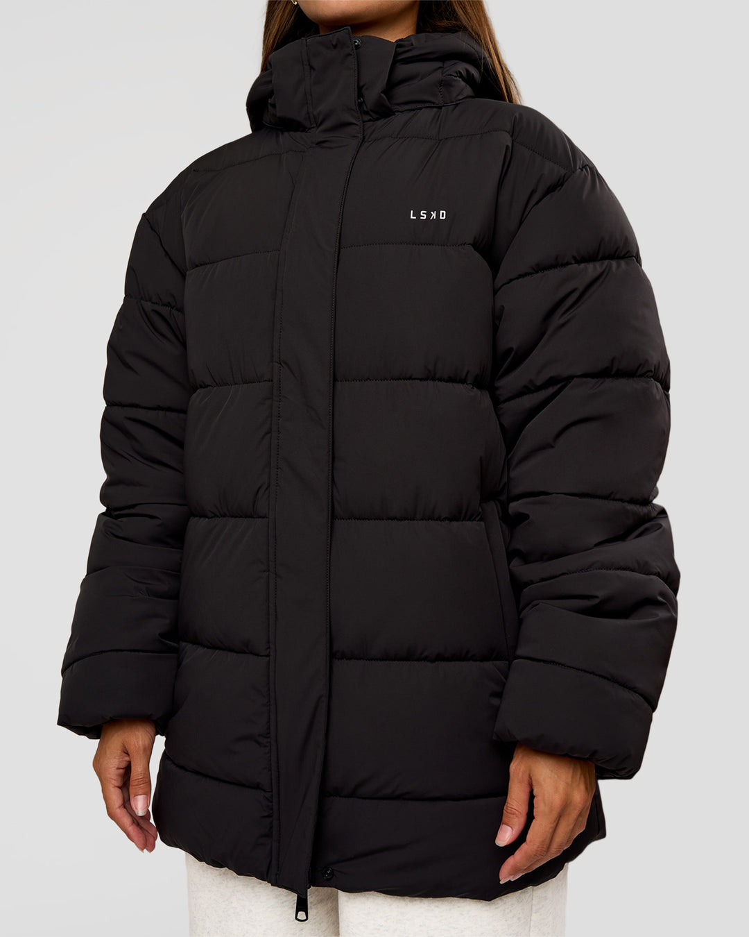 Woman wearing Go-To Puffer Mid Jacket - Black | Model:Brylee | Size:XS
