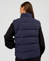Woman wearing Go-To Puffer Vest - Future Navy | Model:Brylee | Size:XS