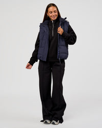 Woman wearing Go-To Puffer Vest - Future Navy | Model:Brylee | Size:XS