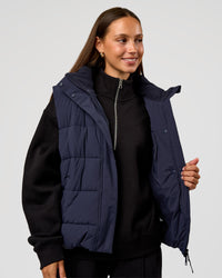Woman wearing Go-To Puffer Vest - Future Navy | Model:Brylee | Size:XS