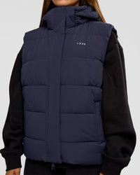 Woman wearing Go-To Puffer Vest - Future Navy | Model:Brylee | Size:XS