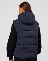 Woman wearing Go-To Puffer Vest - Future Navy | Model:Brylee | Size:XS