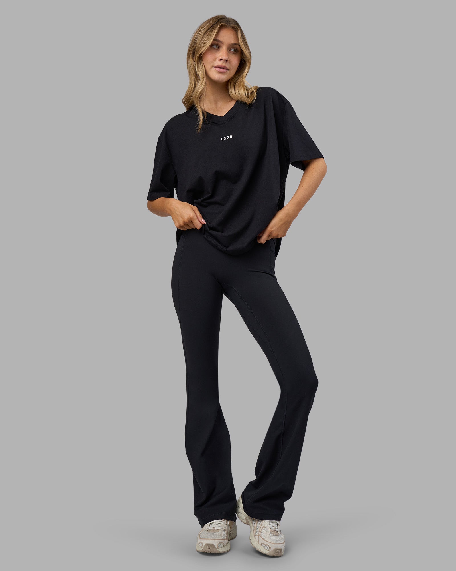 Woman wearing Go-To V-Neck FLXCotton Oversized Tee - Black-White | Model:Leilani | Size:XS