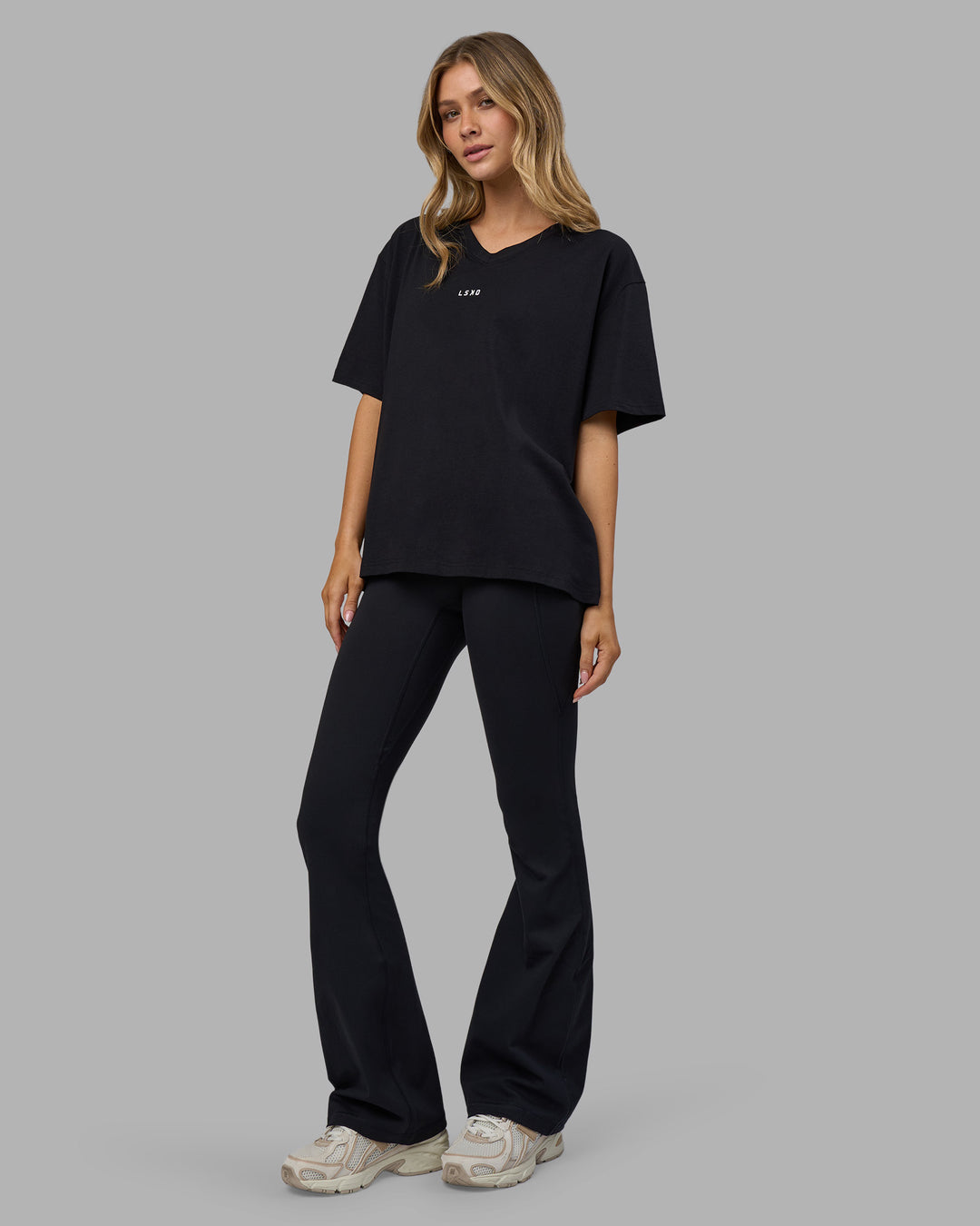 Woman wearing Go-To V-Neck FLXCotton Oversized Tee - Black-White | Model:Leilani | Size:XS