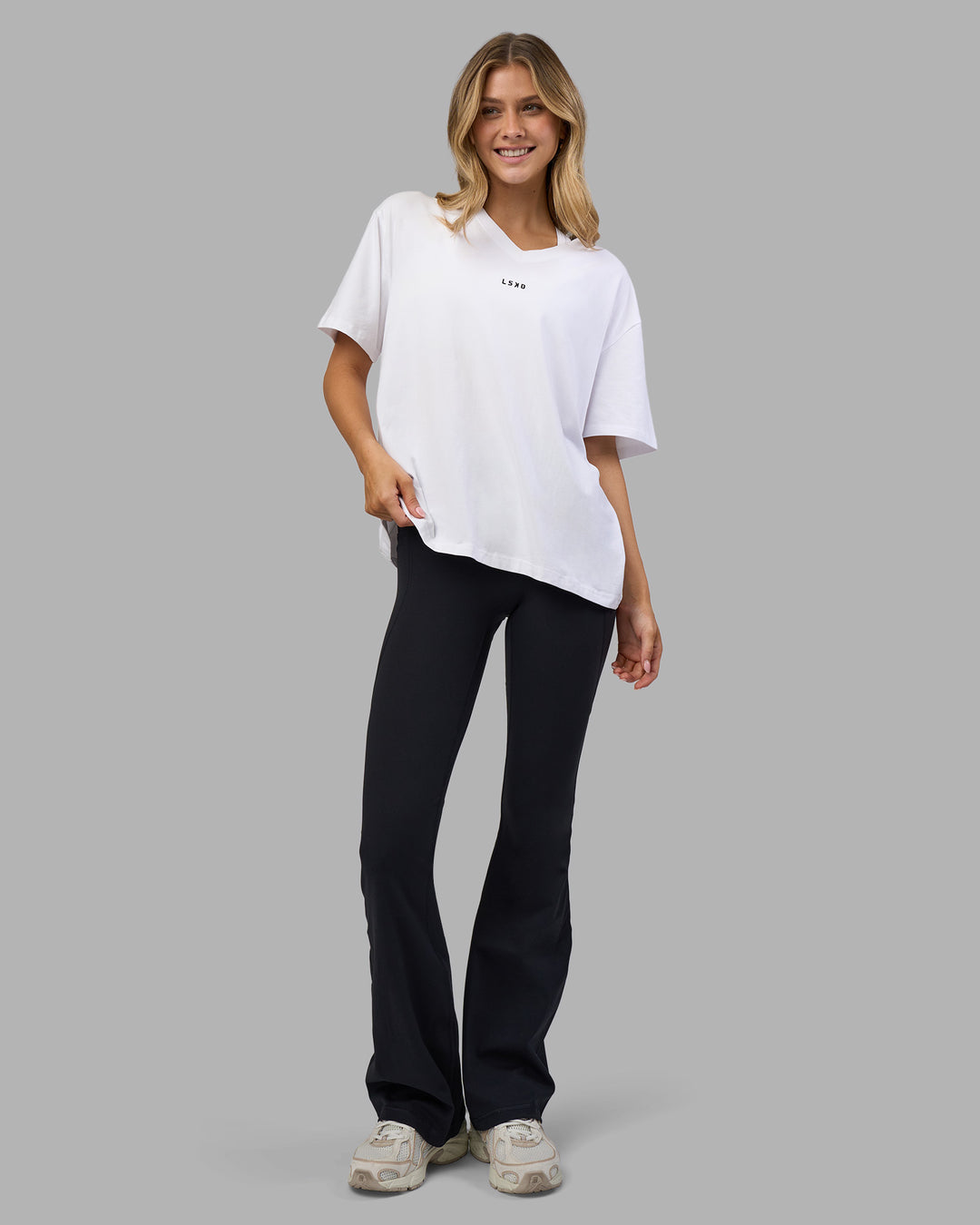 Woman wearing Go-To V-Neck FLXCotton Oversized Tee - White-Black | Model:Leilani | Size:XS