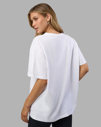 Woman wearing Go-To V-Neck FLXCotton Oversized Tee - White-Black | Model:Leilani | Size:XS