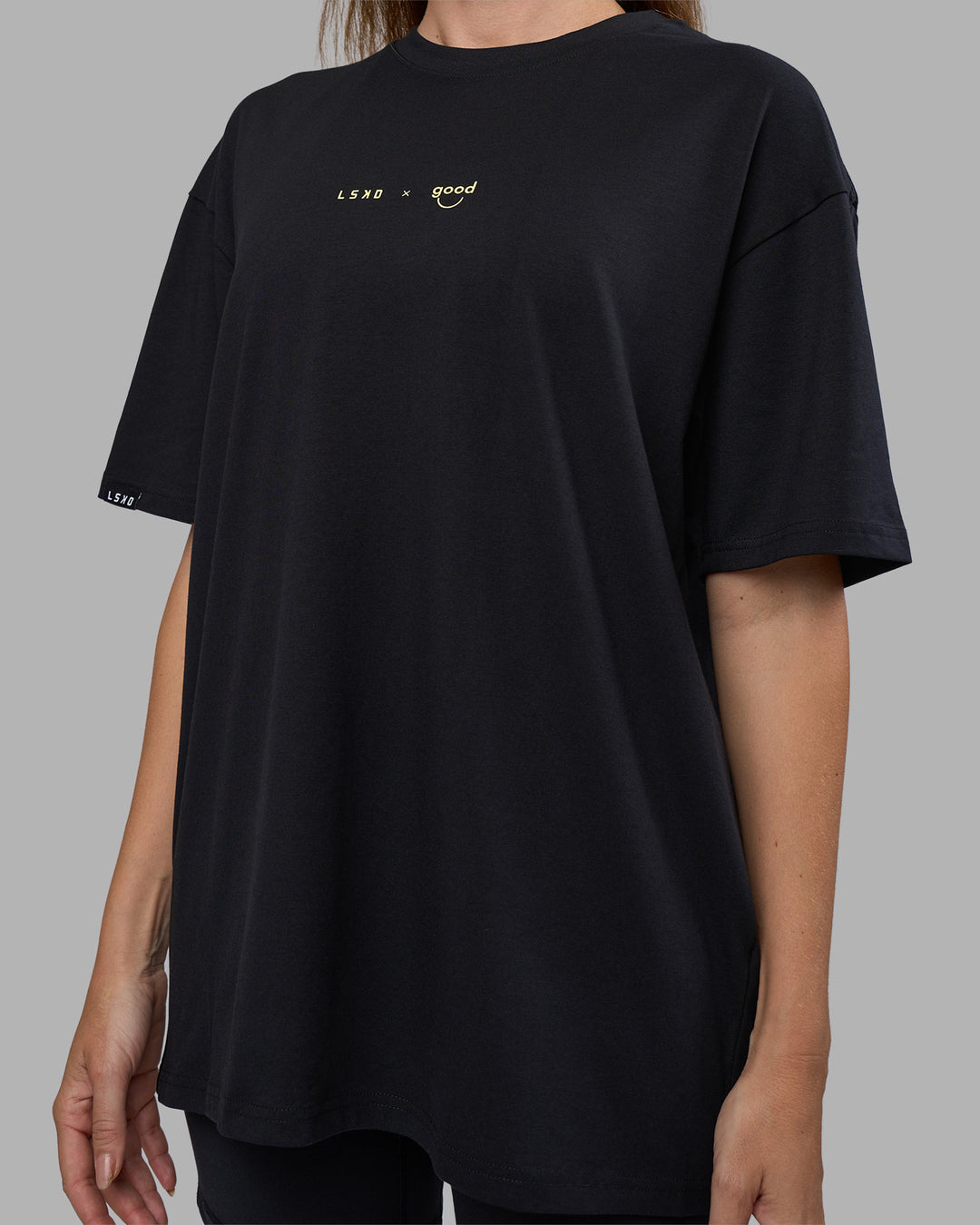 Woman wearing Good Human Factory Vol 2 FLXCotton Oversize Tee - Black | Size:XS