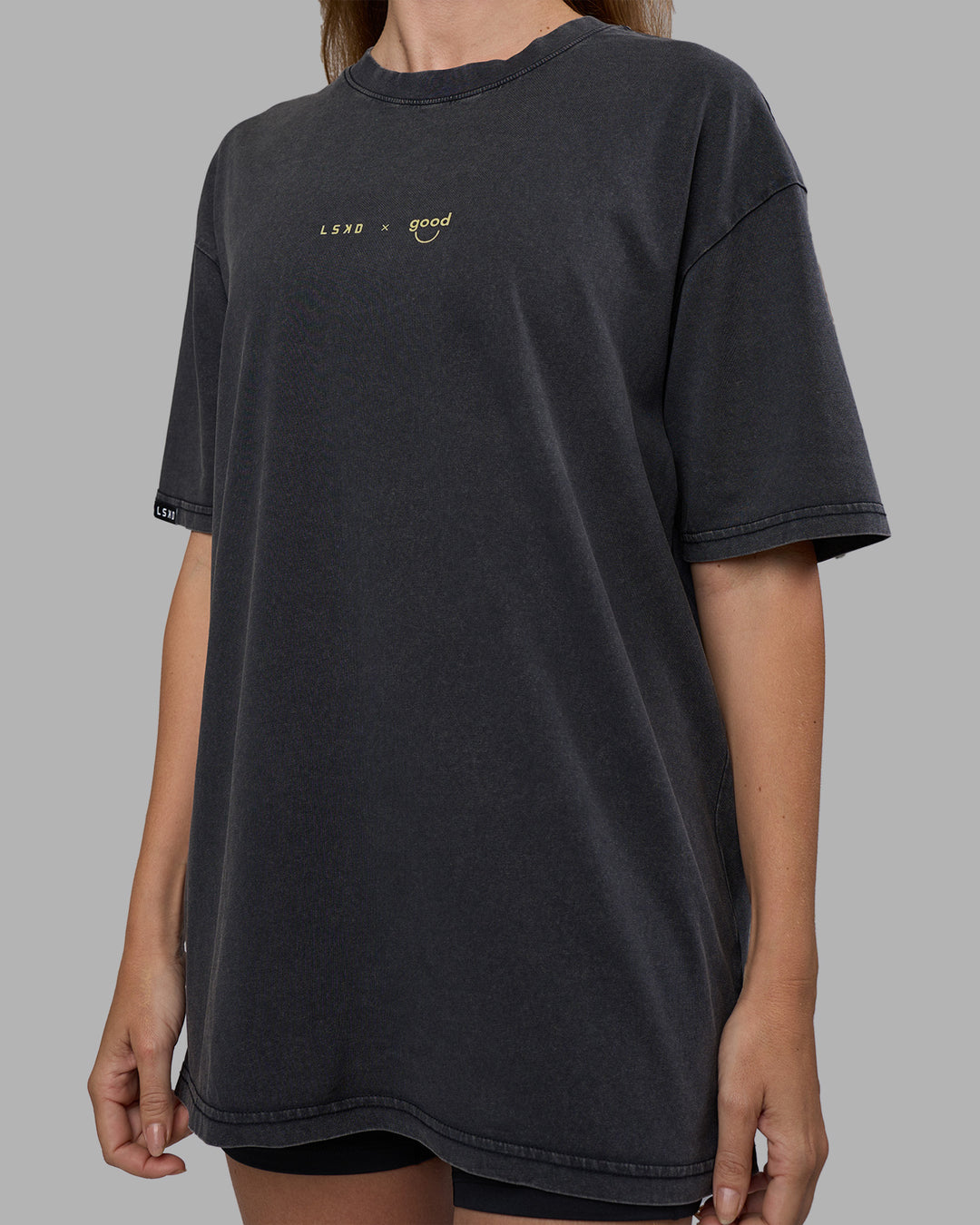 Woman wearing Good Human Factory Vol 2 FLXCotton Oversize Tee - Black Washed | Size:XS