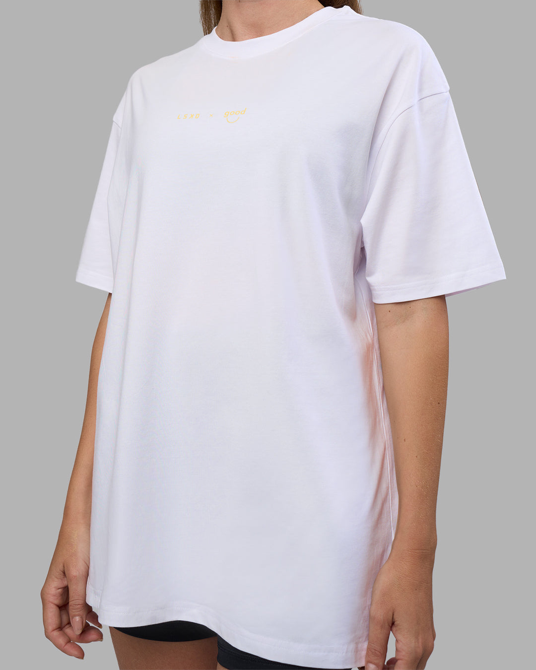 Woman wearing Good Human Factory Vol 2 FLXCotton Oversize Tee - White | Model:Carol | Size:XS