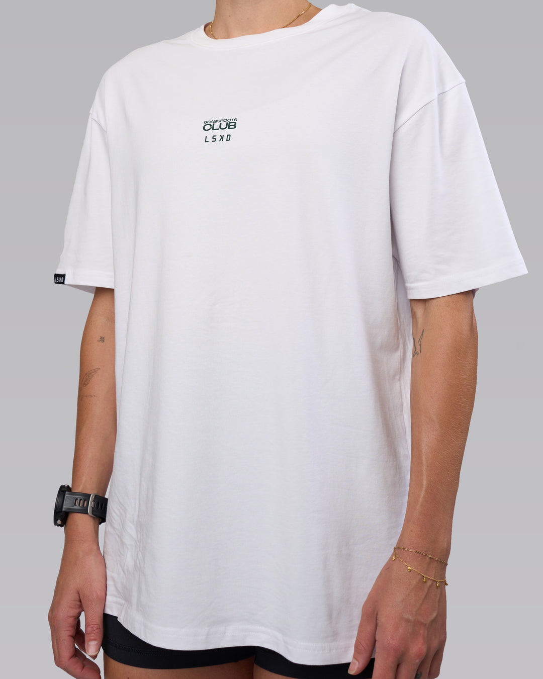 Woman wearing Grass Roots CFC FLXCotton Oversize Tee - White | Model:Shae | Size:XS