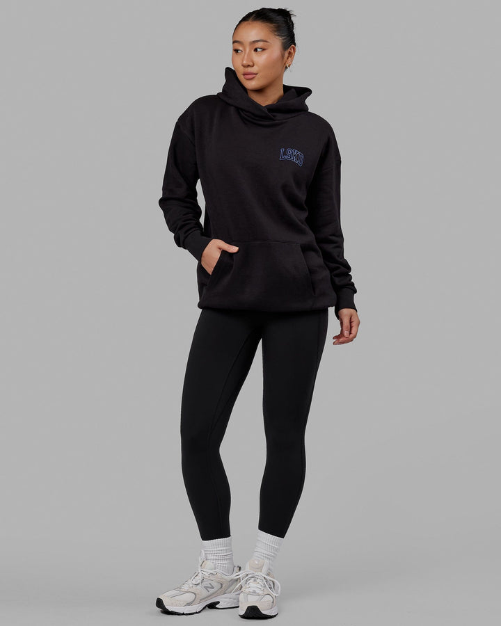 Woman wearing Unisex Guild Hoodie Oversize - Black