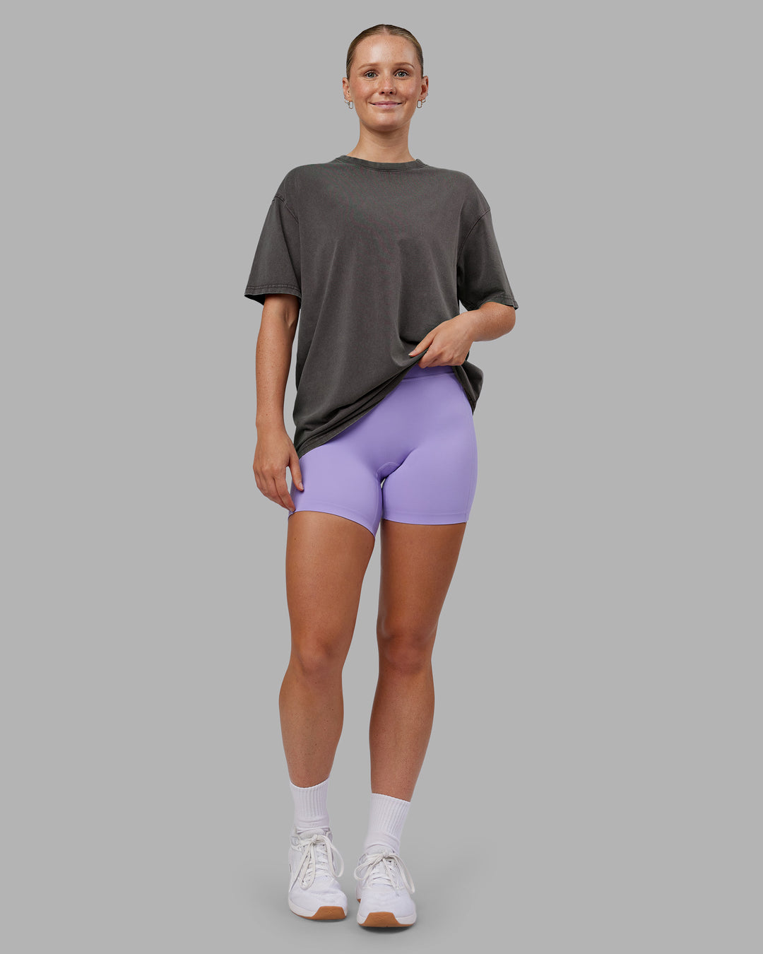 Woman wearing Heart FLXCotton Oversized Tee - Washed Dark Storm-Violet Ray | Model:Neve | Size:XS