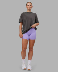 Woman wearing Heart FLXCotton Oversized Tee - Washed Dark Storm-Violet Ray | Model:Neve | Size:XS